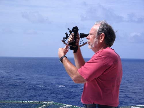 Carl Smith using a sextent at sea